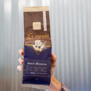 a hand holding a bag of Sagrado Coffee Spirit Mountain