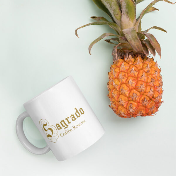Sagrado Coffee 110z mug next to a pineapple 2